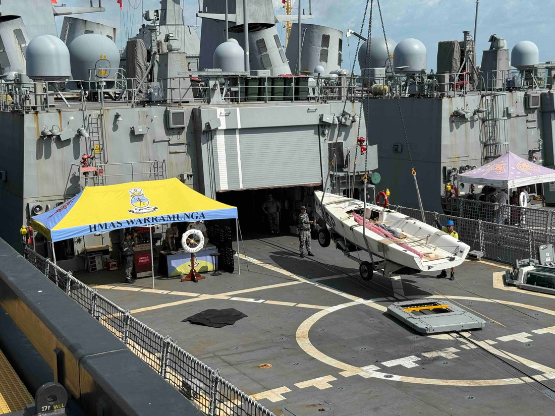 Craning the Saltwater Veterans Sailing Project Elliott 7 yacht onto HMAS Warramunga as part of Royal Australian Navy Defence Aid to the Civil Community support.