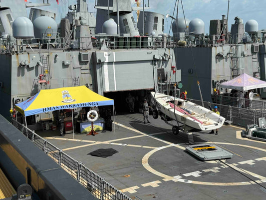 Craning the Saltwater Veterans Sailing Project Elliott 7 yacht onto HMAS Warramunga as part of Royal Australian Navy Defence Aid to the Civil Community support.